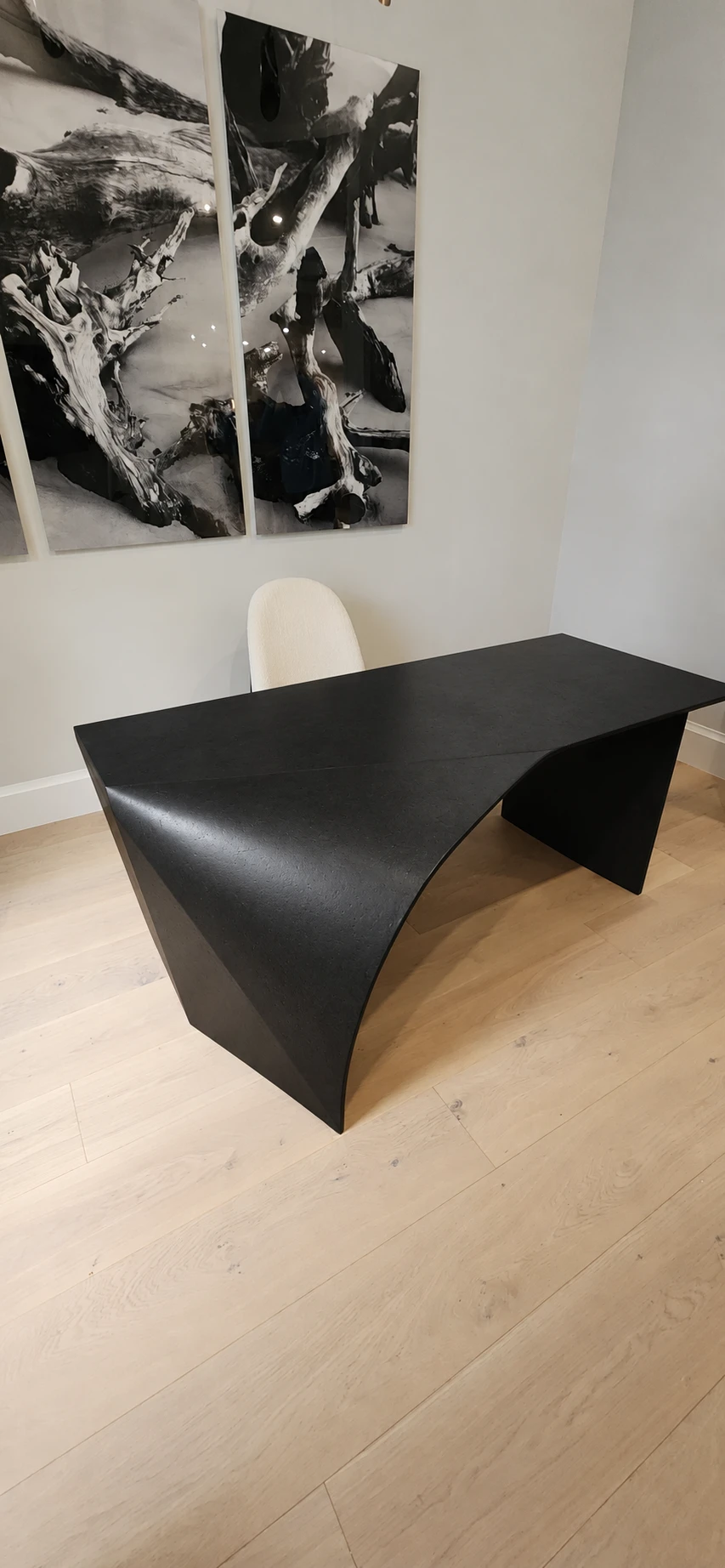 Black concrete desk finish preview, showing its sculptural curved sides