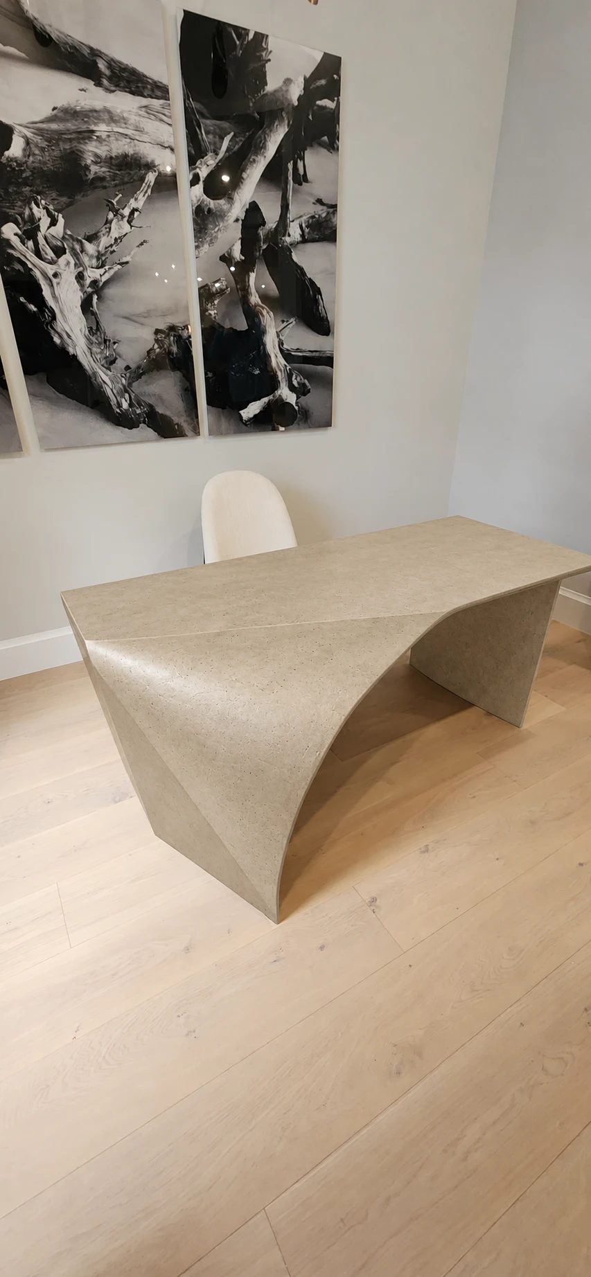 Tan concrete desk finish preview, showing its sculptural curved sides
